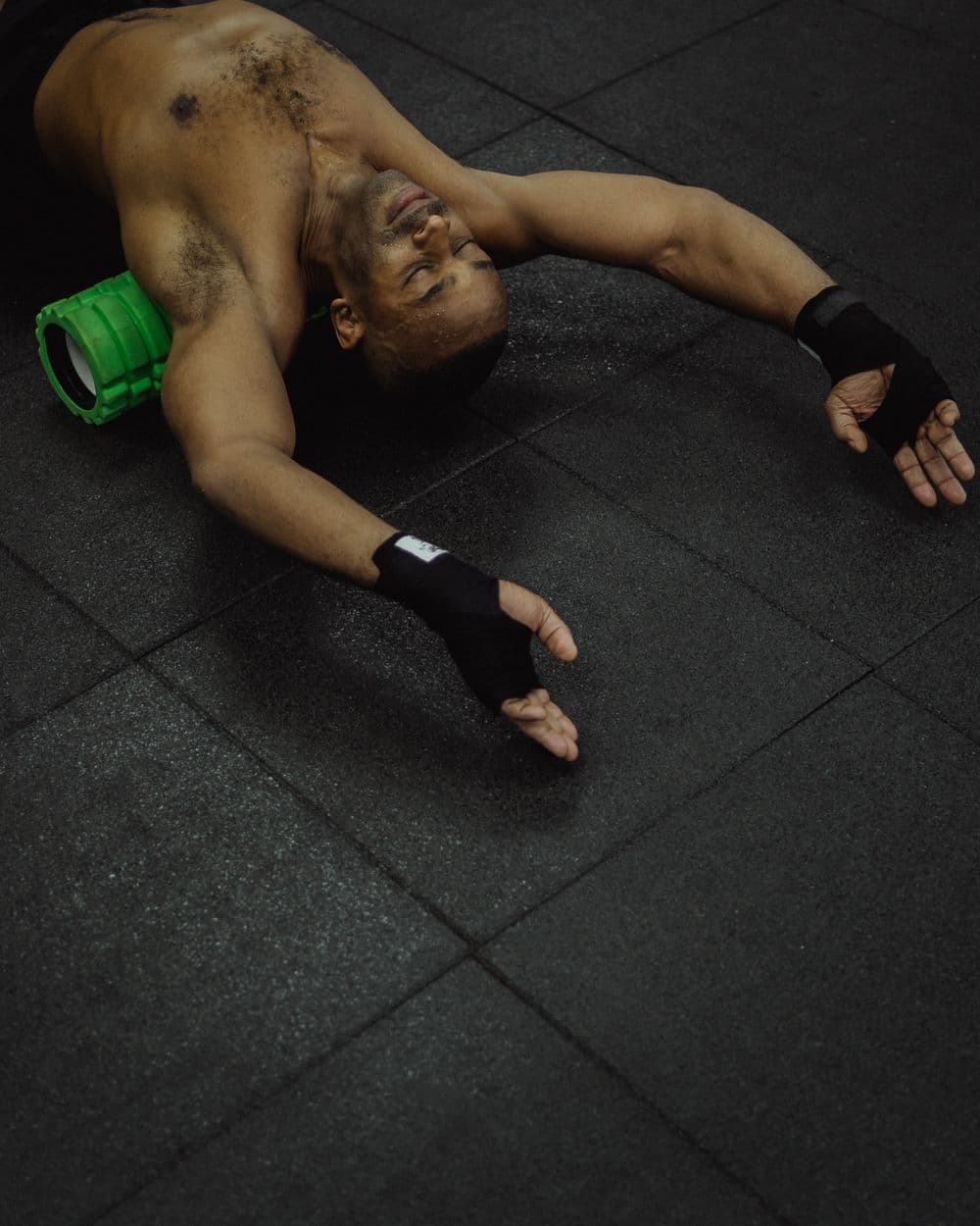 Athlete on a foam roller during recovery.